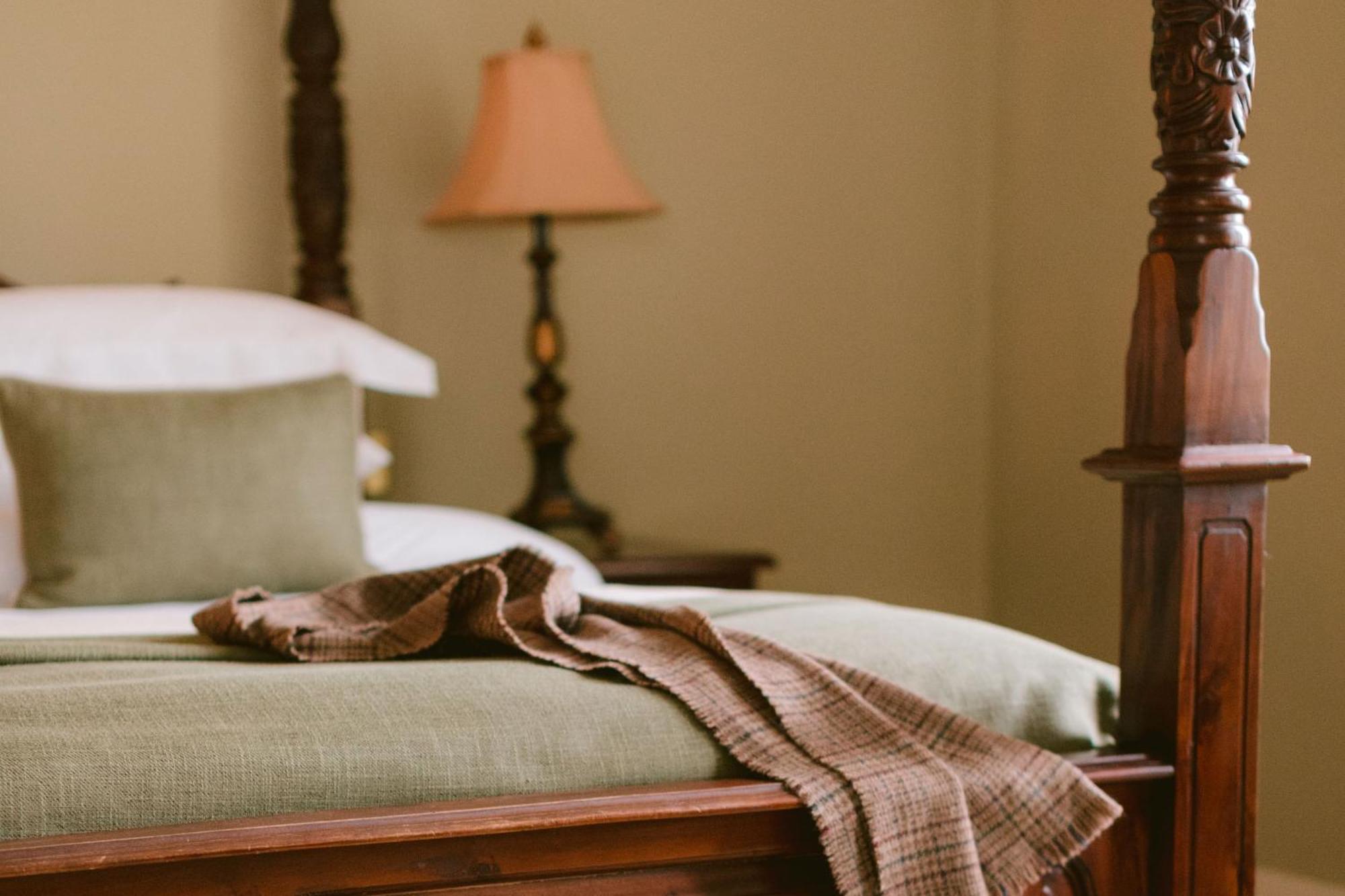 Lough Erne Resort Enniskillen Exterior photo A bed with a throw